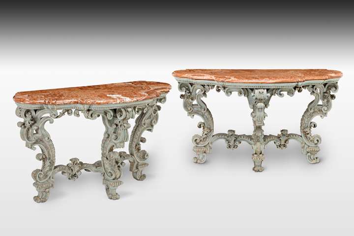 A magnificent pair of Italian, Piedmontese light blue patined and carved baroque Console Tables, with their original alabaster marble tops (alabastro fiorito), probably after the design of Filippo Juvarra.